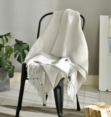 Fringed Knitted Throw Blanket - draped on a bench