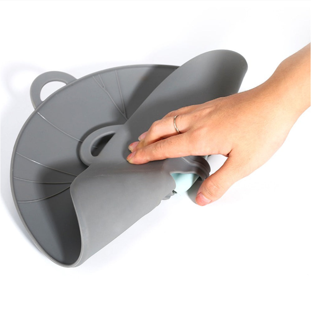 Silicone Spill-Proof Pot Cover - on a kitchen counter