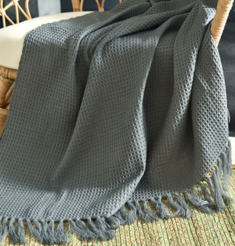 Fringed Knitted Throw Blanket - draped on a sofa